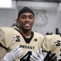 Speed Plus alumni in Bryant University gold #4 uniform