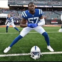 Speed Plus alumni in Indianapolis Colts #57 blue uniform pregame